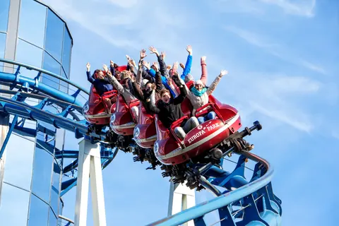 Riders on a Europa-Park coaster train