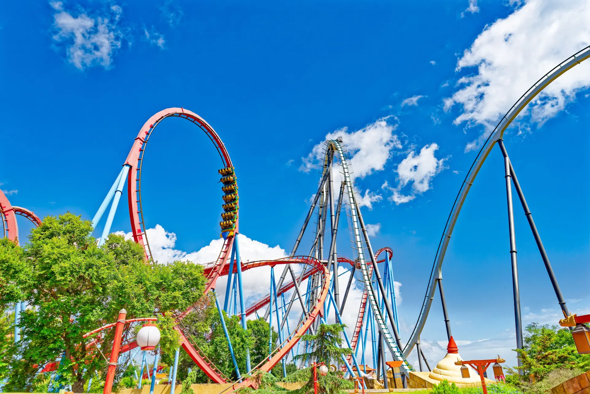 Dragon Khan loops tangling with Shambhala's hyper-coaster hill — PortAventura Park in Salou, Catalonia