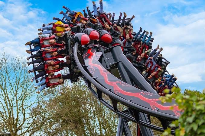 Nemesis Reborn twisting riders through its inverted turn — Alton Towers in Staffordshire, England