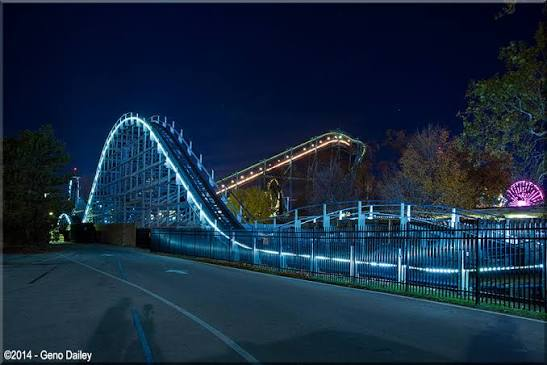 Blue Streak glowing along the midway at night — Cedar Point in Sandusky, Ohio