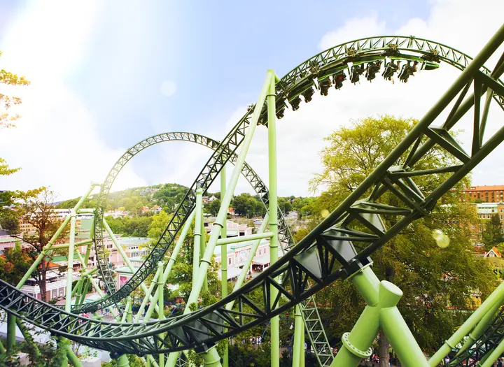 Helix twisting through its green loops above the park — Liseberg in Gothenburg