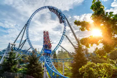 Blue Fire Megacoaster looping at sunset — Europa-Park in Rust, Baden-Württemberg