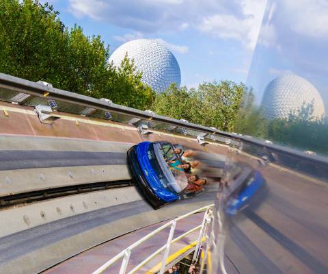 Test Track Vehicle Speeding Past Spaceship Earth — EPCOT in Bay Lake, Florida