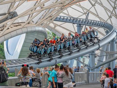 Riders Speeding Along TRON Lightcycle Run — Magic Kingdom in Bay Lake, Florida