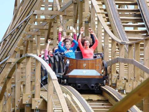 Riders on Heidi The Ride Wooden Coaster — Plopsaland De Panne in De Panne