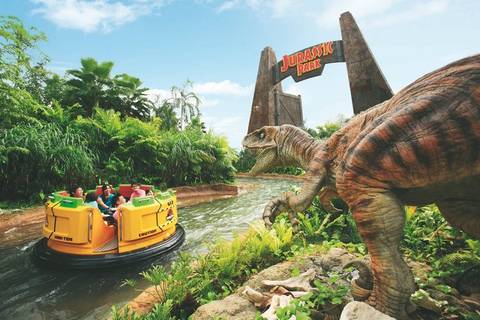 Riders on Jurassic Park Rapids Adventure — Universal Studios Singapore in Sentosa Island