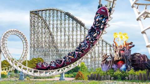 Big Loop Inversions with Colossos in the Background — Heide Park Resort in Soltau, Lower Saxony