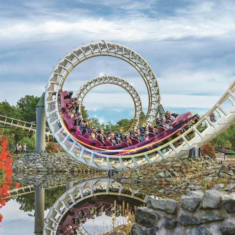 Riders Navigating the Corkscrews of Big Loop — Heide Park Resort in Soltau, Lower Saxony