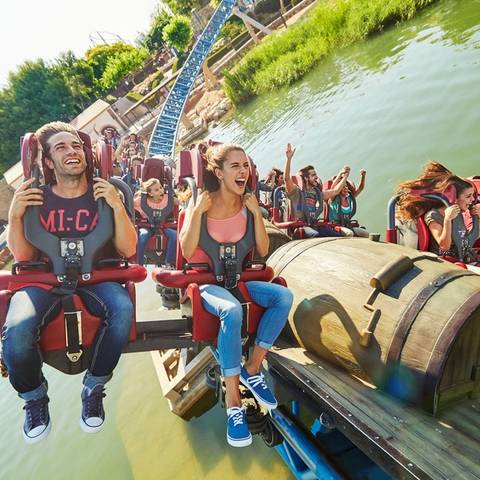 Riders Skimming the Lake on Furius Baco — PortAventura Park in Salou, Catalonia