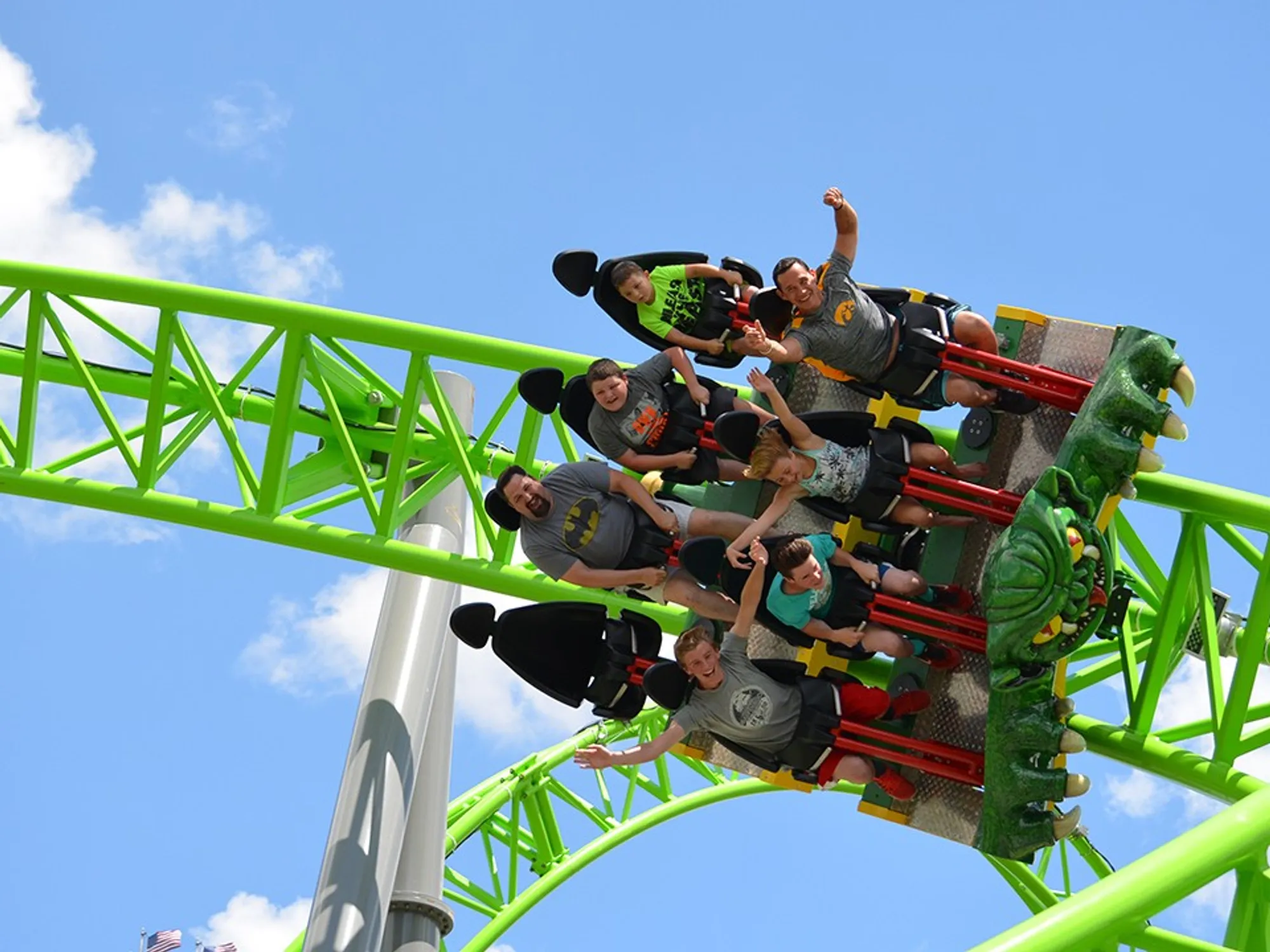 Within the visitor-planning section — A family coaster and a major thrill coaster at one finalist, presented as a paired image illustrating variety rather than quantity alone