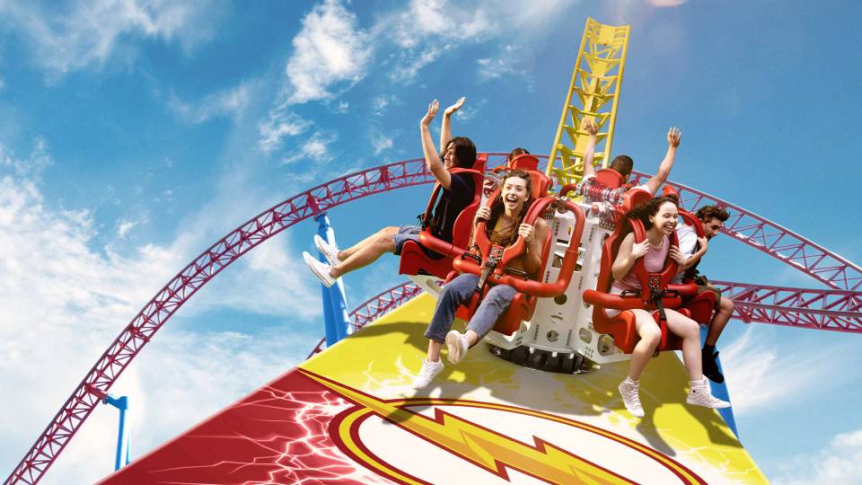 Hero, above the short-answer table — A clearly labeled two-park pairing showing recognizable guest-facing areas at Dreamworld and Movie World, with comparable framing