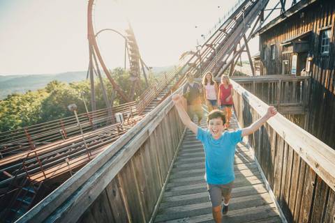 Family Celebrating Beside the Outlaw Run Roller Coaster — Silver Dollar City in Branson, Missouri