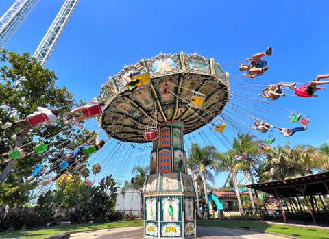 Riders Soaring on the Wave Swinger in Fiesta Village — Knott's Berry Farm in Buena Park, California