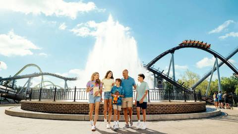 Family by Chocolatetown Fountain with Candymonium Overhead — Hersheypark in Hershey, Pennsylvania